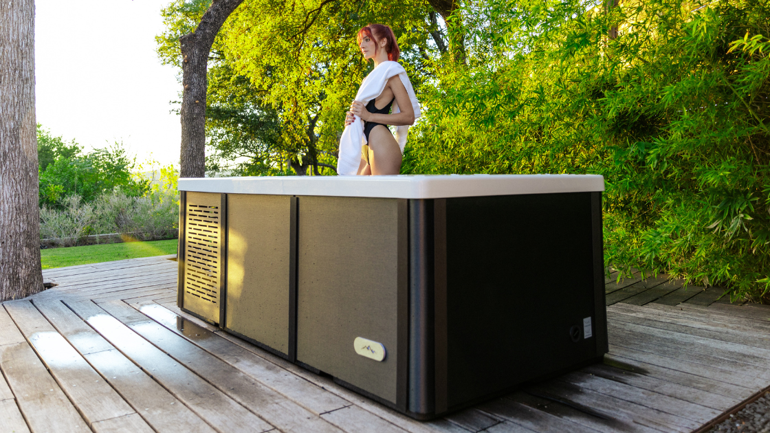 Outdoor setup with a cold plunge tub next to plug and play hot tubs, illustrating a simple hot–cold contrast therapy routine.